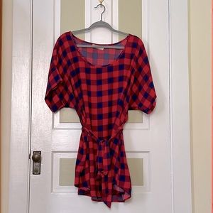 Red-and-blue checkered tie-waist blouse.